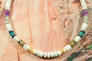 Genuine Howlite with Turquoise, Sugilite, Blue Lapis and Spiny Oyster Shell Accents. Sterling Silver and Gold Fill Barrels. Sterling Silver Cones, Beads & Clasp.  Beautiful Necklace Created by Navajo Artist Tommy Singer. Signed.